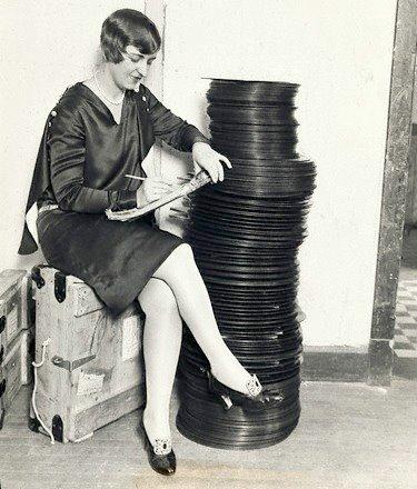 A Warner Brothers employee in Chicago inspects Vitaphone disks before shipping them out