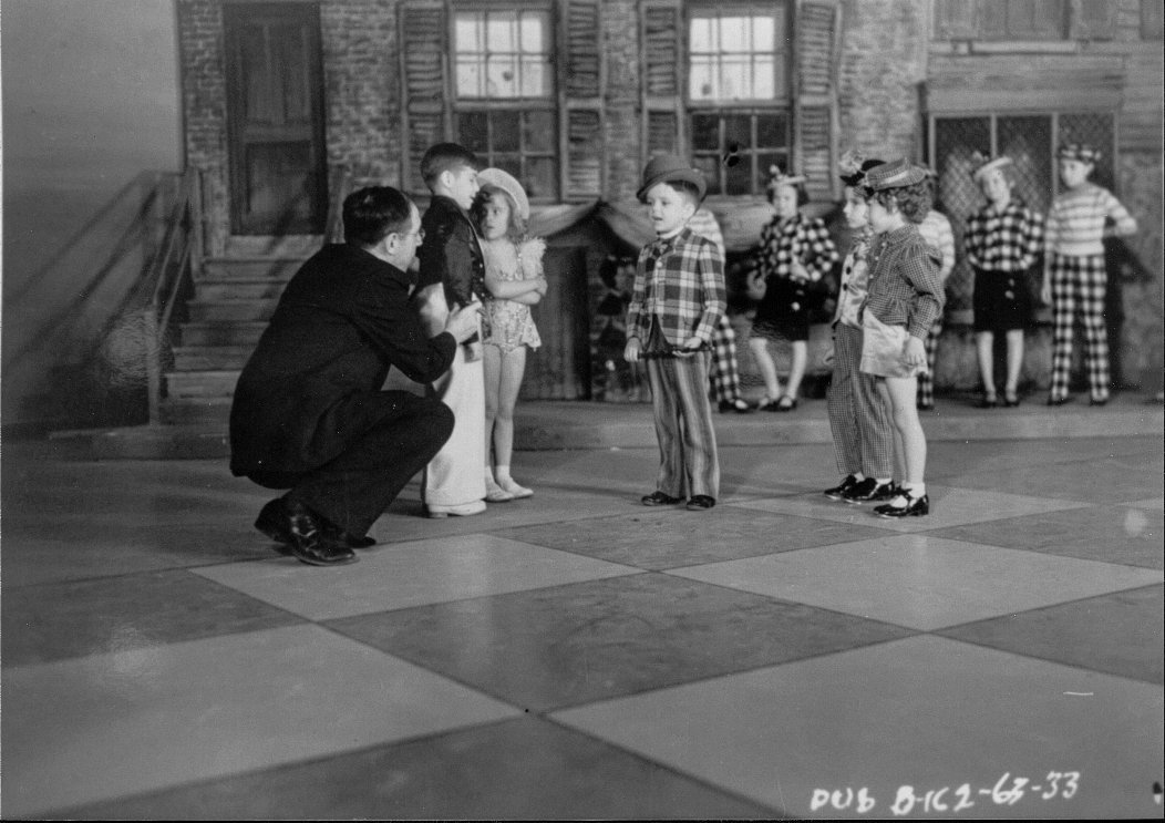 Joseph Henabery directing a scene from TOYLAND CASINO (1938) in Brooklyn.